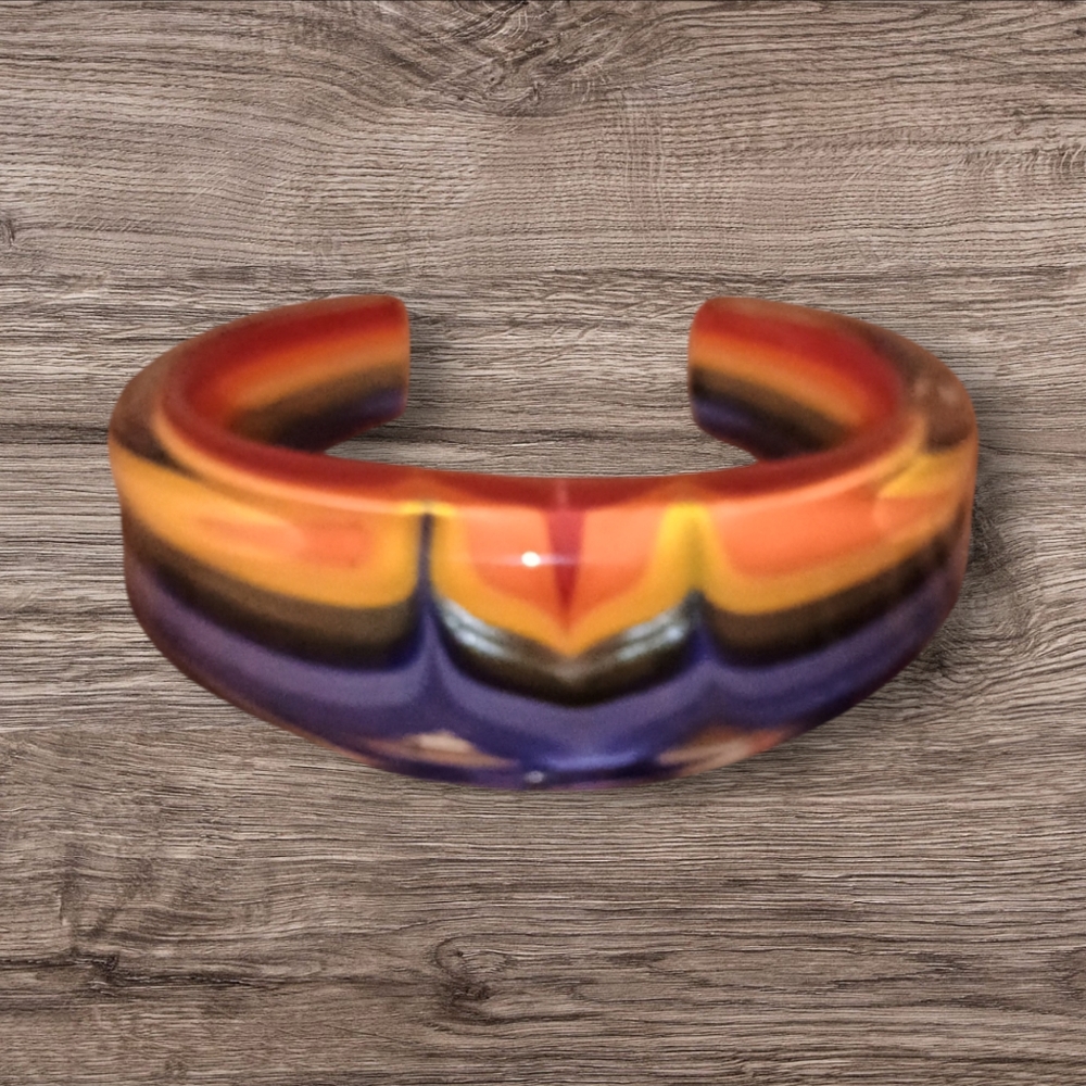 Handblown rainbow colored glass cuff bracelet